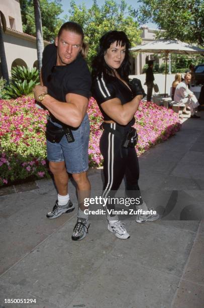 American wrestlers Triple H and Chyna striking a pose during the WB Summer TCA Press Tour at the Ritz-Carlton Hotel in Pasadena, California, July...