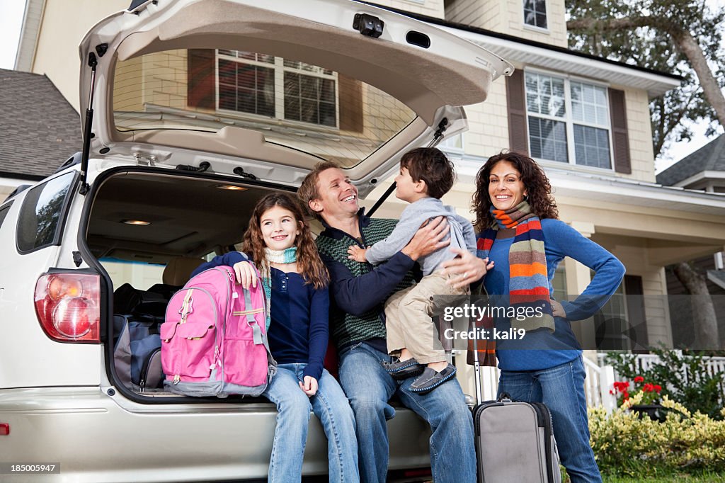 Family going on road trip with car and luggage