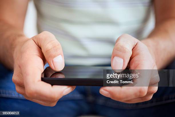 man with smartphone - telephone game stock pictures, royalty-free photos & images