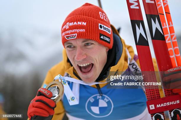 Germany's Benedikt Doll celebrates after winning in the men 10km sprint event of the IBU Biathlon World Cup in Lenzerheide, eastern Switzerland, on...