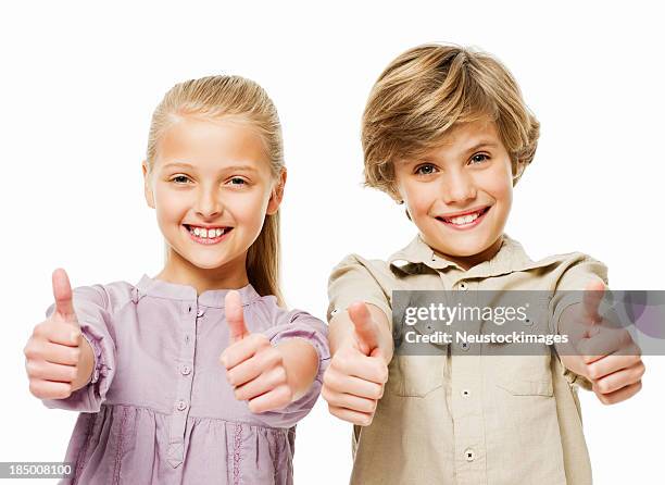 hermano y hermana dando pulgar hacia arriba-aislados - pulgar arriba fotografías e imágenes de stock
