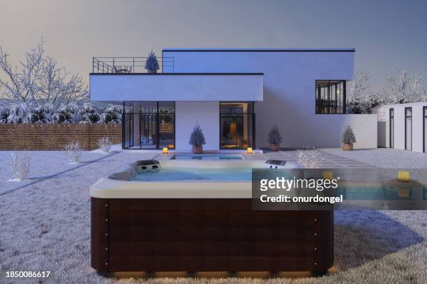 exterior of luxurious modern villa with hot tub and swimming pool in winter - varmbadpool bildbanksfoton och bilder