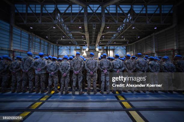 Soldiers of the Bundeswehr stand in line after leaving an A400m transport plane as they return from Mali on December 15, 2023 in Wunstorf, Germany....