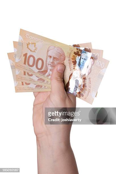 handful of dollars - canadian one hundred dollar bill 個照片及圖片檔