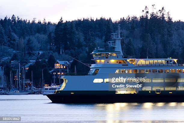 ferry parked at bainbridge island on a snowy evening - washington state ferry stock pictures, royalty-free photos & images