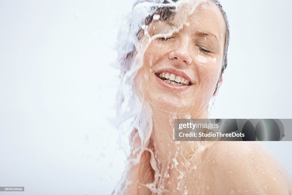 Young woman having a shower