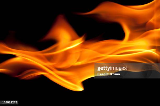 fire burning, flames on black background - flame texture stock pictures, royalty-free photos & images