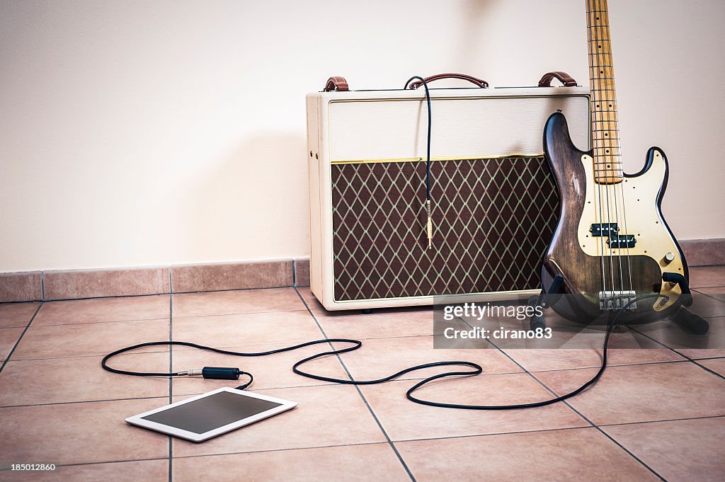 Bass Guitar, Amp And Digital Tablet