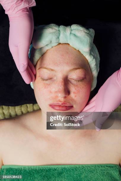 beautician assessing clients face - hair band stock pictures, royalty-free photos & images