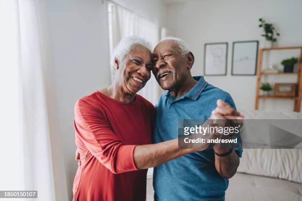 happy and carefree senior couple - old couple dancing stock pictures, royalty-free photos & images