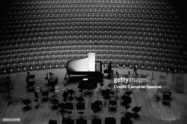 Pianist rehearses on a grand piano in the concert hall at the Sydney Opera House on September 20, 2013 in Sydney, Australia. On October 20, 2013 the...