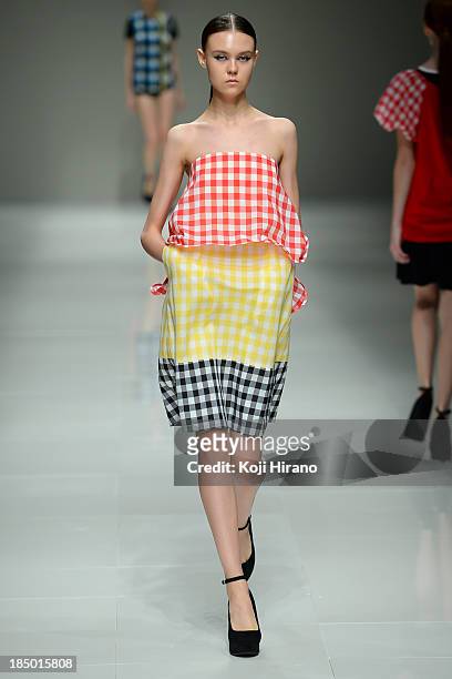 Model showcases designs on the runway during the Han Ahn Soon show as part of Mercedes Benz Fashion Week TOKYO 2014 S/S at Hikarie A Hall of Shibuya...