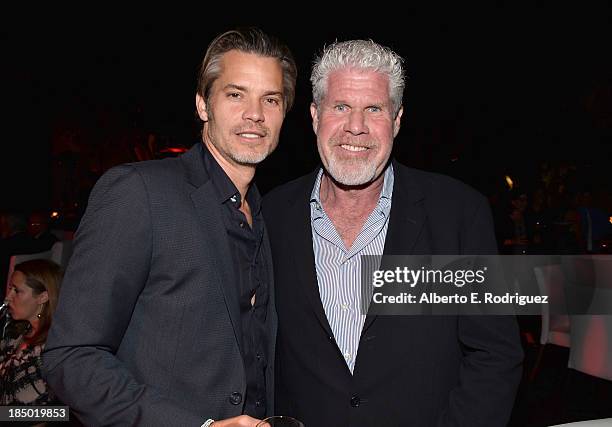 Actors Timothy Olyphant and Ron Perlman attend The Paley Center for Media's 2013 benefit gala honoring FX Networks with the Paley Prize for...