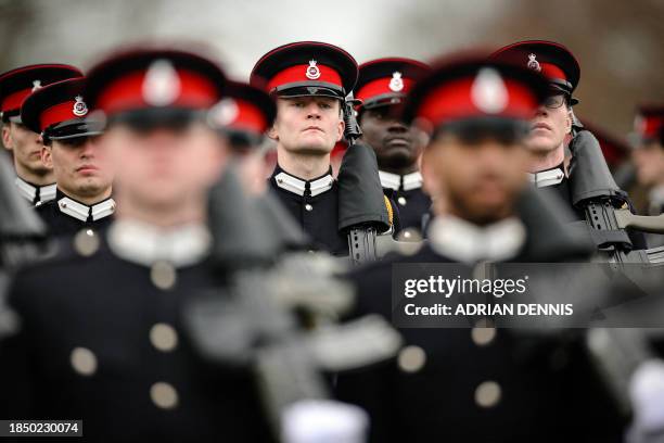 Army officer cadets march across the parade ground during Commissioning Course No. 231 Sovereign's Parade, at the Royal Military Academy Sandhurst...