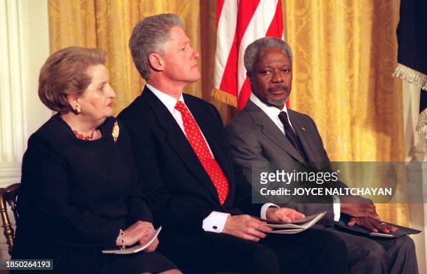 President Bill Clinton sits with Secretary of State Madeleine Albright and UN Secretary General Kofi Annan during an International Women's Day event...