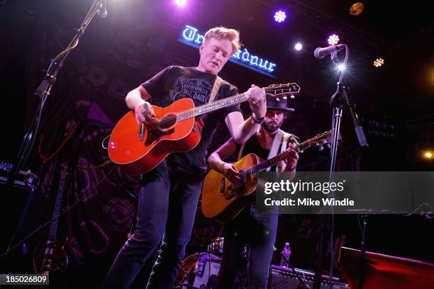 Conan O'Brien peforms onstage with Langhorne Slim & The Law at the Troubadour on October 16, 2013 in West Hollywood, California.