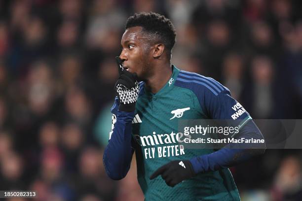 Eddie Nketiah of Arsenal celebrates after scoring his team's first goal during the UEFA Champions League match between PSV Eindhoven and Arsenal FC...