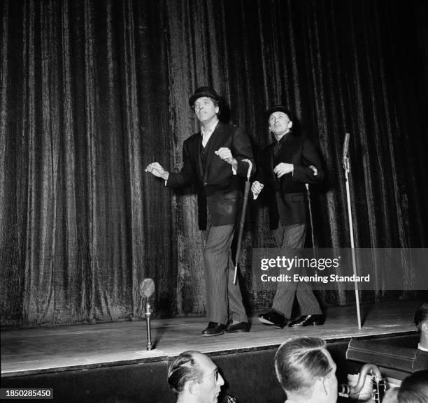 Actors Burt Lancaster and Kirk Douglas onstage in costume during rehearsals for 'Night of 100 Stars' charity performance, London Palladium, July 22nd...