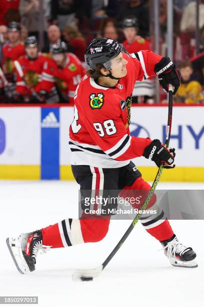 Connor Bedard of the Chicago Blackhawks skates with the puck against the Nashville Predators in overtime at the United Center on December 05, 2023 in...