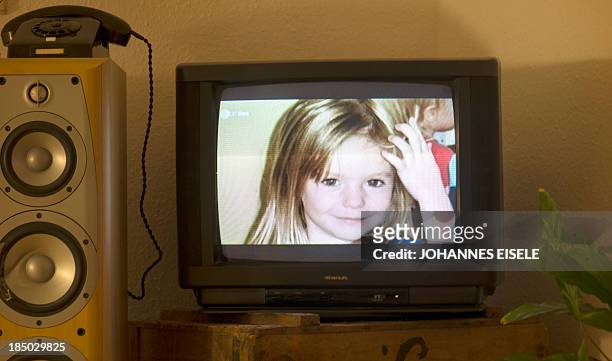 Photo of British girl Madeleine McCann aka Maddie is displayed on a TV screen at an appartmen in Berlin, on October 16, 2013 during the broadcast of...