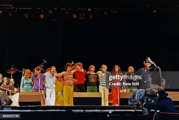 Mike Oldfield and his band take a final bow after performing on stage at the Knebworth Festival, on June 21st, 1980 in Hertfordshire, England....