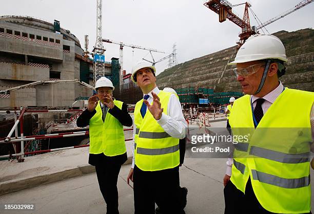 British Chancellor of the Exchequer George Osborne talks with Guo Liming of Taishan Nuclear Power Joint Venture Co Ltd and EDF Energy CEO Vincent de...