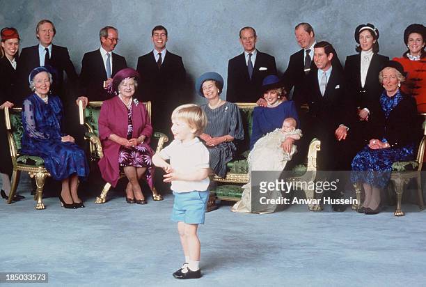 Royal relatives and godparents who are amused at the antics of young Prince William, Prince Harry is christened at Windsor Castle on December 21,...