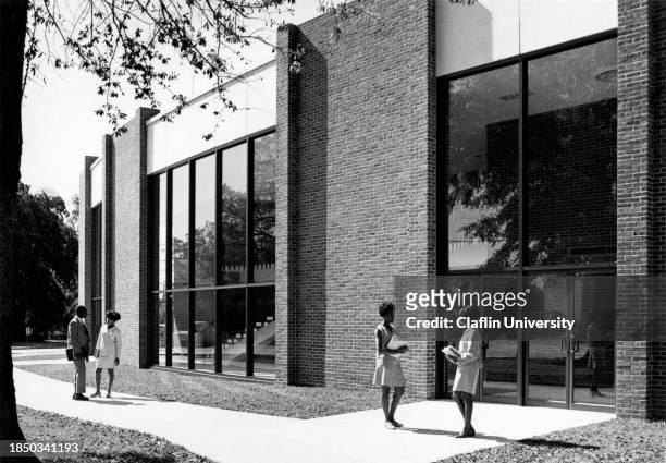 University students standing outside the W.V. Middleton Fine Arts Center on the campus of Claflin University in Orangeburg, South Carolina.