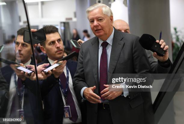 Sen. Lindsey Graham speaks to reporters before a Senate luncheon at the U.S. Capitol on December 12, 2023 in Washington, DC. Senators met today with...