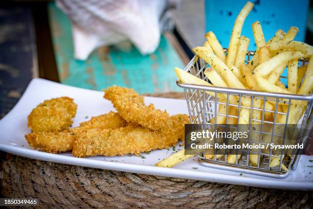 fish fried croquette with french fries - fish finger stock pictures, royalty-free photos & images