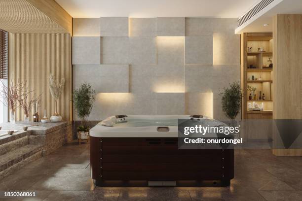luxuriöses spa-interieur mit whirlpool, marmorboden und topfpflanzen - whirlpool stock-fotos und bilder