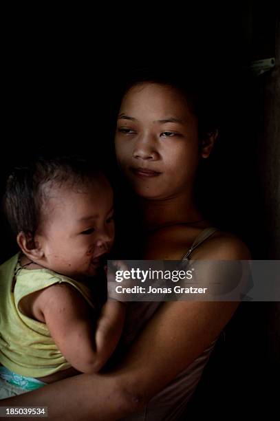 Year old girl carries her 10 month old baby - she is forced to make a living through prositution in Cagayan de Oro. Abortion in the Philippines is...