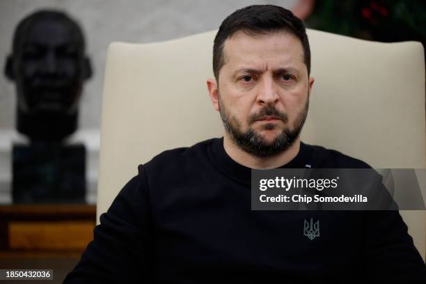 Ukrainian President Volodymyr Zelensky talks to reporters while meeting with U.S. President Joe Biden in the Oval Office at the White House on...