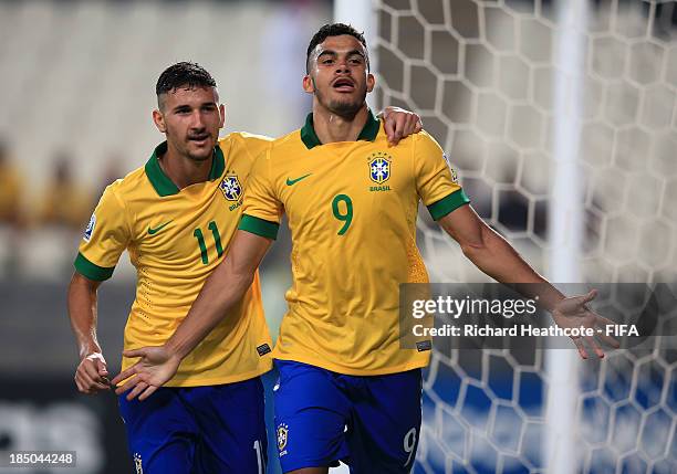 Mosquito of Brazil celebrates scoring his third goal during the FIFA U-17 World Cup UAE 2013 group A match between Brazil and Slovakia at the Mohamed...