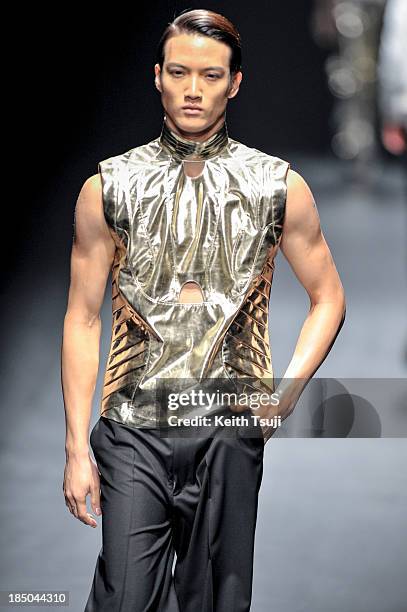 Model showcases designs on the runway during the Christian Dada show as part of Mercedes Benz Fashion Week Tokyo 2014 S/S at Hikarie Hall A of...