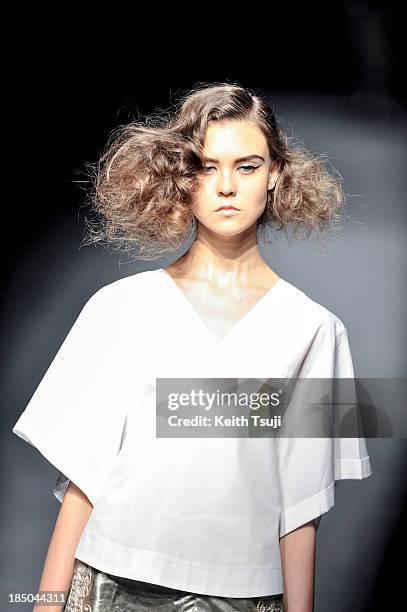 Model showcases designs on the runway during the Christian Dada show as part of Mercedes Benz Fashion Week Tokyo 2014 S/S at Hikarie Hall A of...
