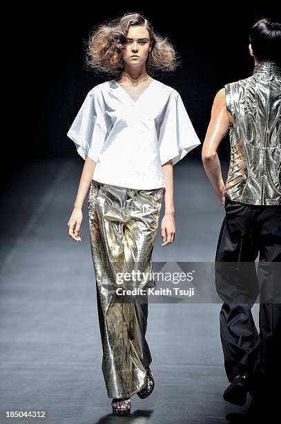 Model showcases designs on the runway during the Christian Dada show as part of Mercedes Benz Fashion Week Tokyo 2014 S/S at Hikarie Hall A of...