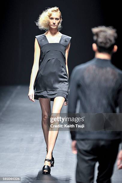 Model showcases designs on the runway during the Christian Dada show as part of Mercedes Benz Fashion Week Tokyo 2014 S/S at Hikarie Hall A of...