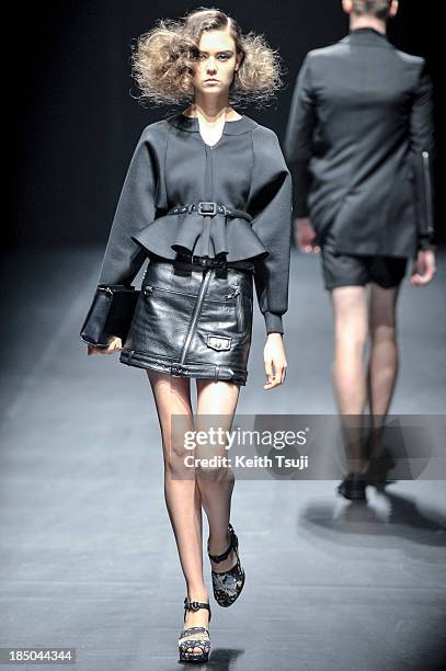 Model showcases designs on the runway during the Christian Dada show as part of Mercedes Benz Fashion Week Tokyo 2014 S/S at Hikarie Hall A of...