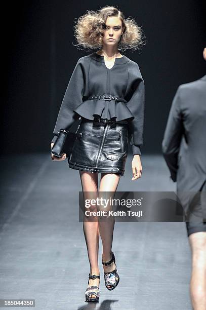 Model showcases designs on the runway during the Christian Dada show as part of Mercedes Benz Fashion Week Tokyo 2014 S/S at Hikarie Hall A of...