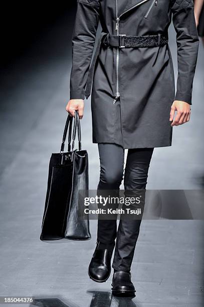 Model showcases designs on the runway during the Christian Dada show as part of Mercedes Benz Fashion Week Tokyo 2014 S/S at Hikarie Hall A of...