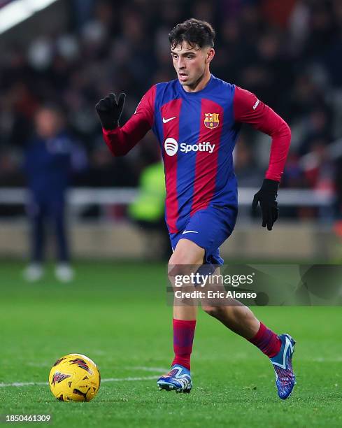 Pedro 'Pedri' Gonzalez of FC Barcelona run with the ball during the LaLiga EA Sports match between FC Barcelona and Atletico Madrid at Estadi Olimpic...