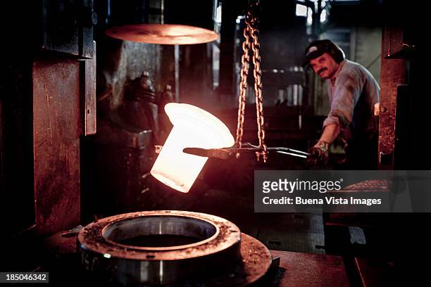 workerts in a steel factory - fucina foto e immagini stock