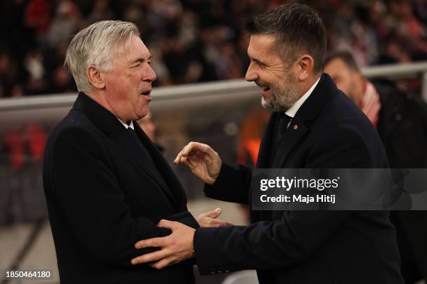 Carlo Ancelotti, Head Coach of Real Madrid, embraces Nenad Bjelica, Head Coach of 1.FC Union Berlin, prior to the UEFA Champions League match between...