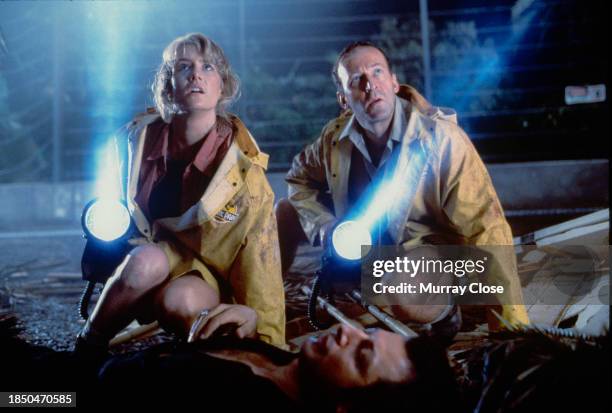 View of American actor Laura Dern , British actor Bob Peck , and American actor Jeff Goldblum in the film 'Jurassic Park' , 1993.