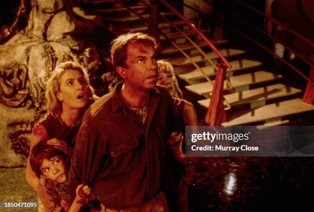 View of, from left, actors Joseph Mazzello , Laura Dern , Sam Neill , and Ariana Richards in the film 'Jurassic Park' , 1993.
