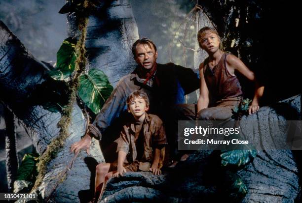 New Zealand actor Sam Neill , with American actors Joseph Mazzello and Ariana Richards , in the film 'Jurassic Park' , 1993.