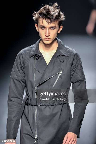 Model showcases designs on the runway during the Christian Dada show as part of Mercedes Benz Fashion Week Tokyo 2014 S/S at Hikarie Hall A of...