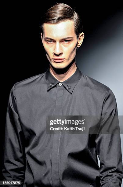 Model showcases designs on the runway during the Christian Dada show as part of Mercedes Benz Fashion Week Tokyo 2014 S/S at Hikarie Hall A of...