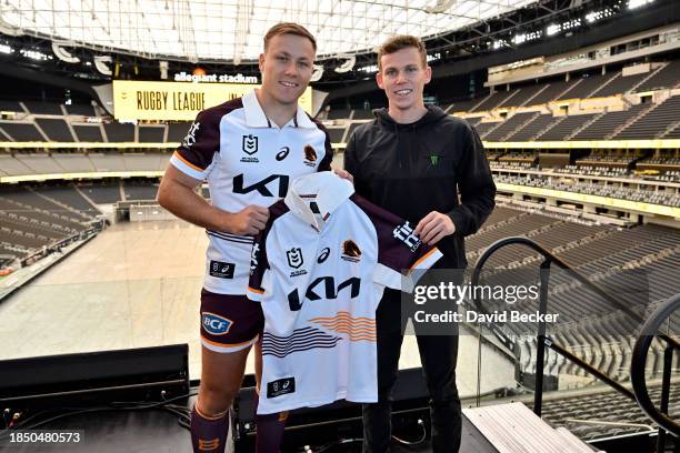 National Rugby League player Billy Walters presents NASCAR driver Riley Herbst a jersey during the National Rugby League – Vegas Promo Tour at...